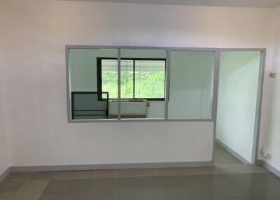 Empty room with large window and interior glass partition