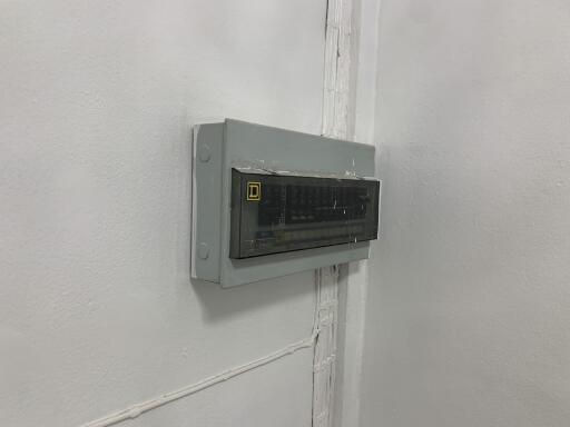 Electrical panel on white wall