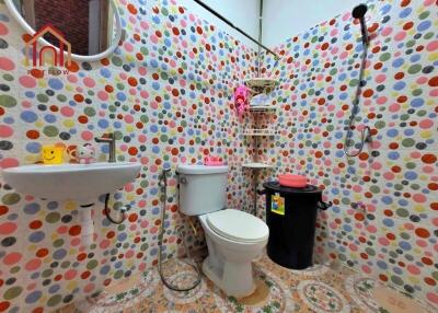 Colorful bathroom with polka dot tiles