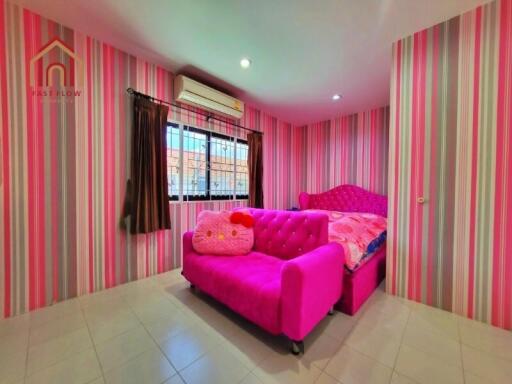 Bedroom with colorful pink themed decor