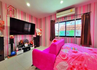 Stylish and vibrant bedroom featuring pink decor