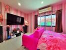 Stylish and vibrant bedroom featuring pink decor