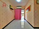 Bright hallway with pink wallpaper and curtain