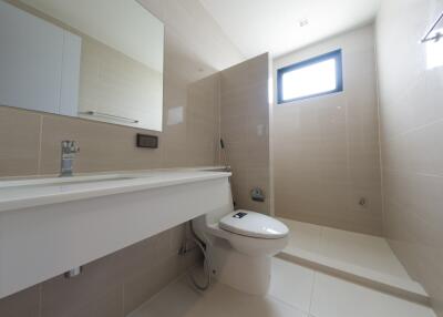 Modern bathroom with large mirror and walk-in shower