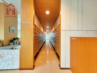 Mailroom with organized mailboxes in a residential building