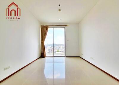 Bright empty living room with large window and city view