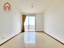 Bright empty living room with large window and city view