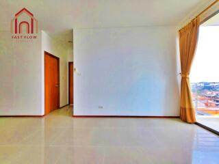 Spacious living room with large window