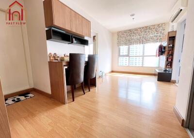 Modern living room with wooden flooring and dining area