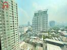 View of surrounding buildings and cityscape from a high-rise