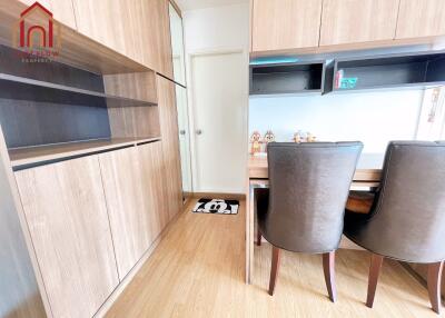 Modern dining area with wooden furnishings and storage