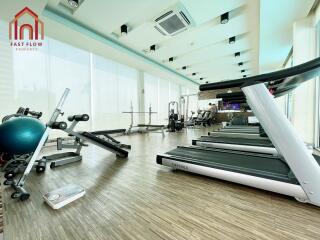 Modern fitness center with various equipment