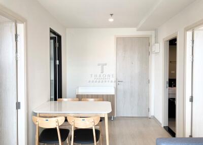 Modern dining area with light wooden furniture and minimalist design