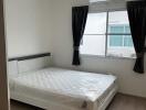 Modern bedroom with window, AC unit, and bed