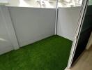 Small balcony with artificial grass