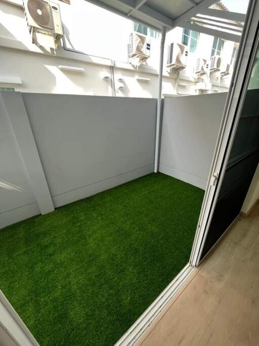 Small balcony with artificial grass