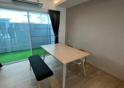 Modern dining area with table and two benches