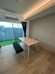 Modern dining area with table and two benches