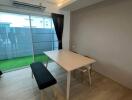 Modern dining area with table and two benches