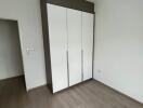 Empty bedroom with a large wardrobe