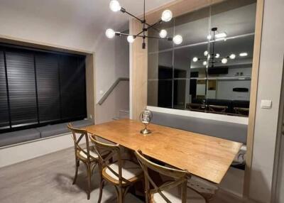 Modern dining room with wooden table and chairs