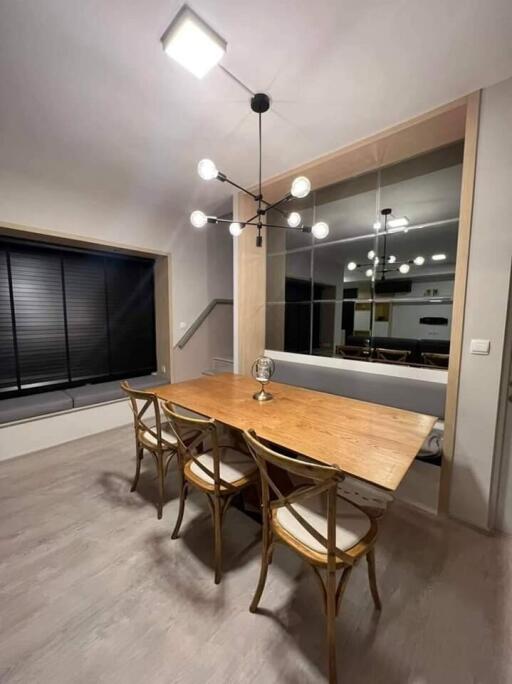 Modern dining room with wooden table and chairs