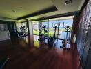 Residential gym with exercise equipment and a view