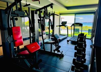 Home gym with exercise equipment and ocean view