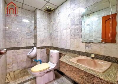 Modern bathroom with granite countertop and tile flooring