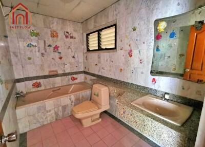 Bathroom with bathtub, toilet, and sink