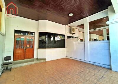 Outdoor area with tiled flooring and wooden ceiling