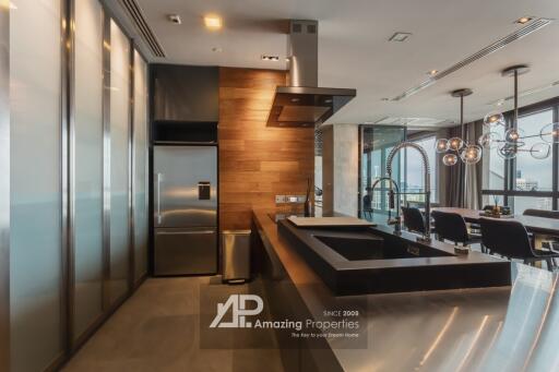 Modern kitchen with stainless steel appliances and wooden accents