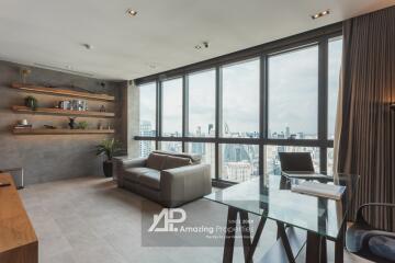 Spacious living room with large windows and city view