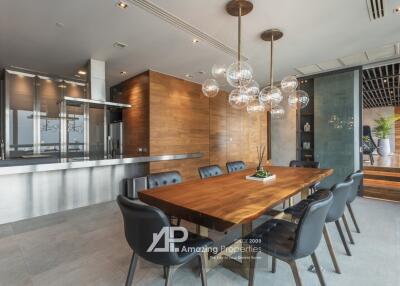 Modern dining room with wooden table and hanging light fixtures