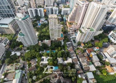 Aerial view of a residential area with tall buildings and green spaces