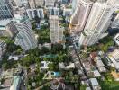 Aerial view of a residential area with tall buildings and green spaces