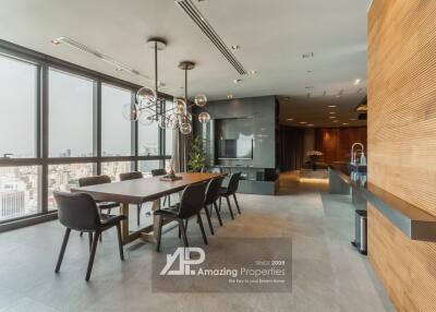 Modern dining area with large windows and city view