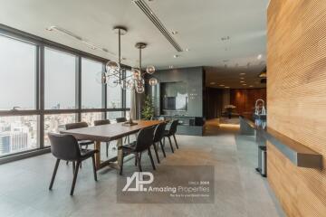 Modern dining area with large windows and city view