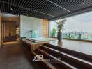 Modern spa area with city view, featuring a wooden deck and indoor jacuzzi