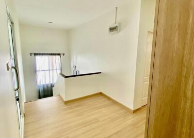 Bright living area with wooden flooring