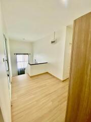 Bright living area with wooden flooring