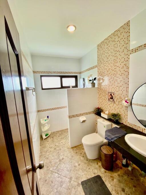 Modern bathroom with a tiled design and contemporary fixtures