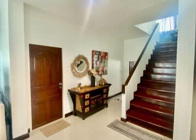 Spacious entryway with staircase