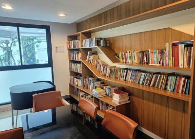Modern home library with bookshelves and seating