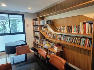 Modern home library with bookshelves and seating