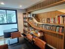 Modern home library with bookshelves and seating