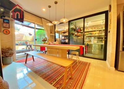 Modern kitchen with attached dining area and ample natural light