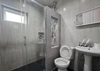 Modern bathroom with large shower area and contemporary fixtures