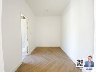 Empty room with wooden floor and white walls