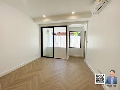 Empty living room with large sliding glass doors